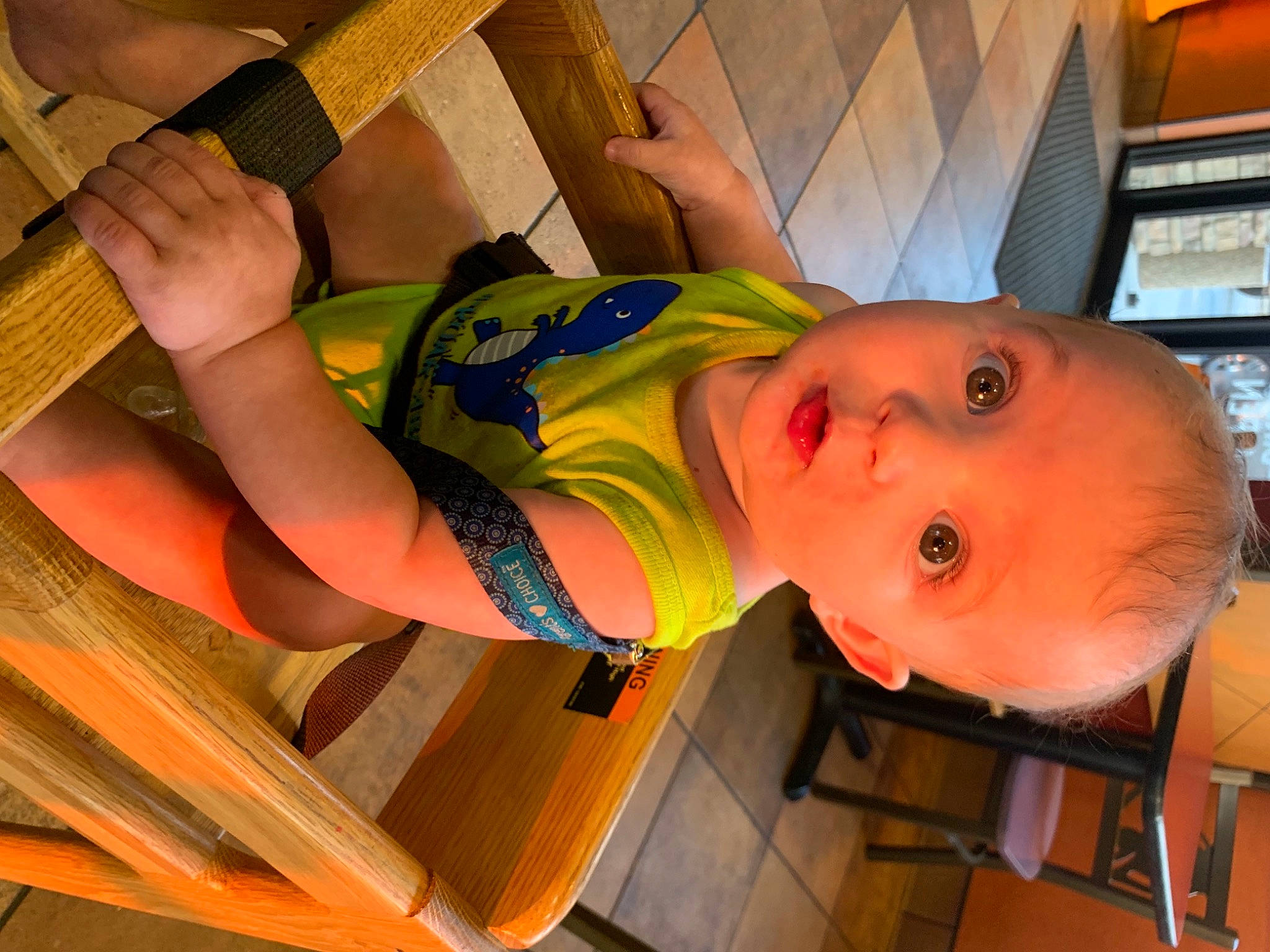 Everett is registered to the contest to win money with this photo: arm, baby, baby_products, child, elbow, finger, fun, happy, human_leg, joint, leisure, neck, orange, person, room, smile, thigh, thumb, toddler, wood