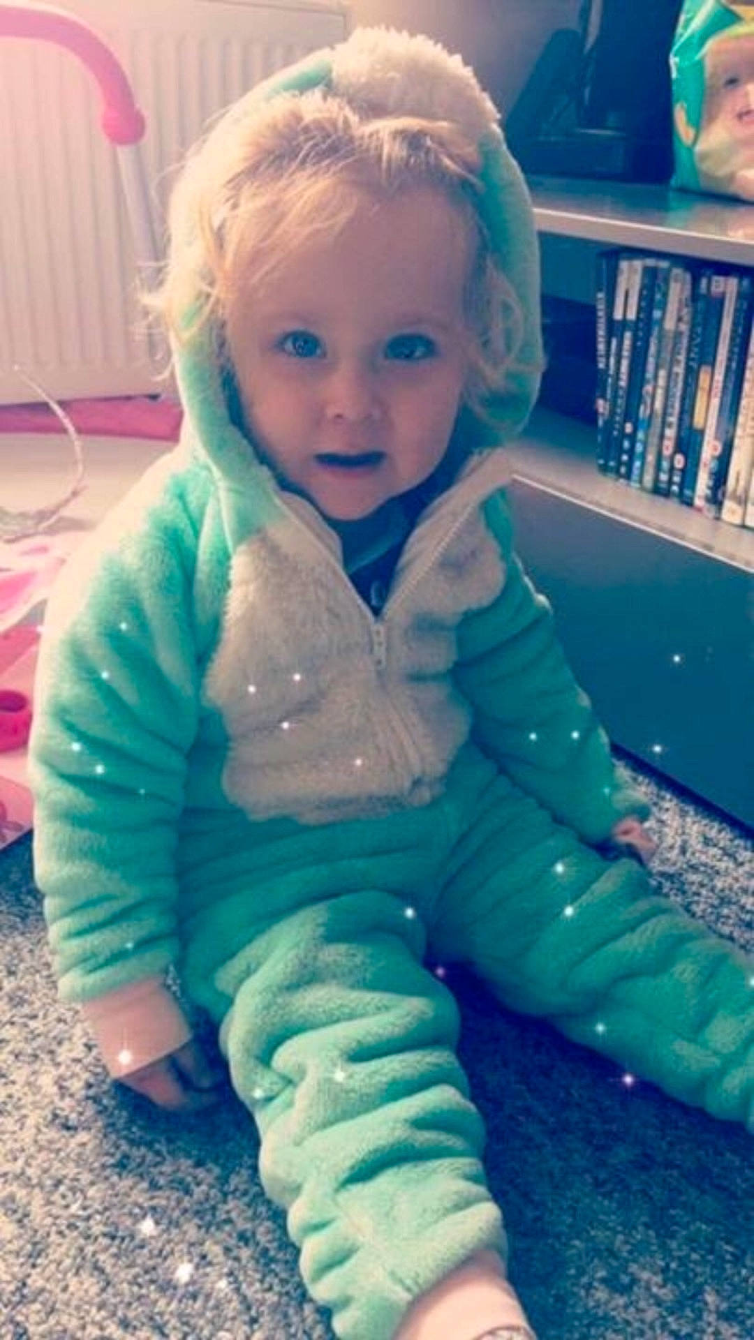 Elsie-mae is registered to the contest to win money with this photo: blue, child, clothing, doll, dress, eye, girl, human_positions, infant, play, skin, toddler, toy