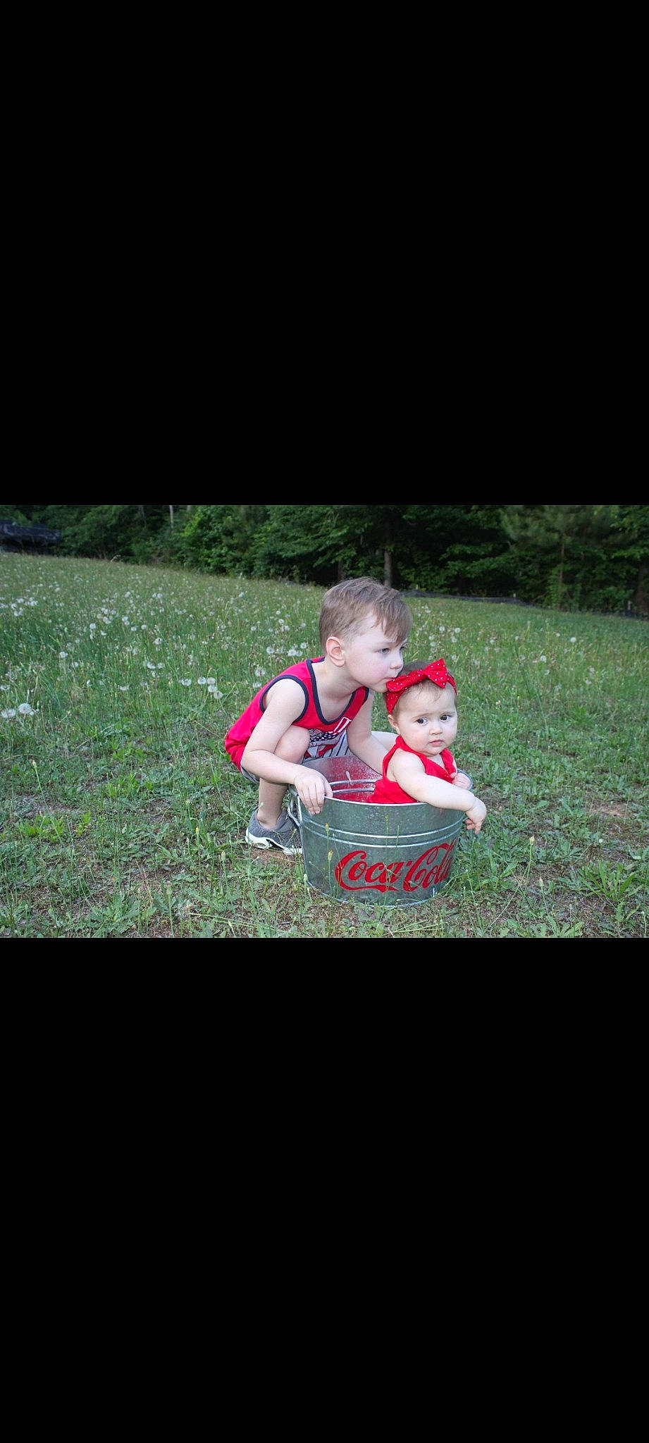 Rylee is registered to the contest to win money with this photo: baby, baby_products, baby_toddler_clothing, carmine, child, flash_photography, fun, grass, happy, lawn, leisure, magenta, people_in_nature, person, photo_caption, plant, play, recreation, sitting, t_shirt