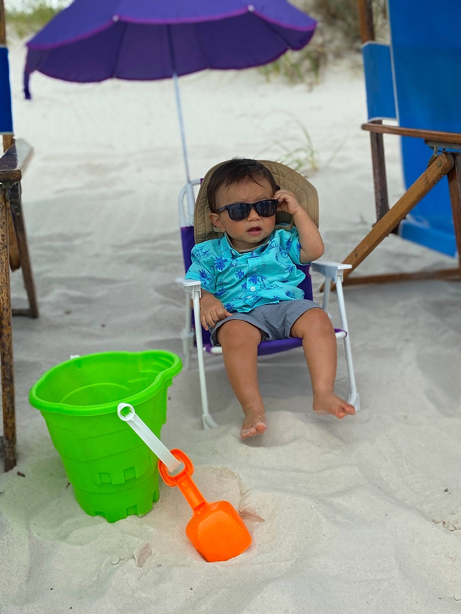 Sergio joined the competition — help win amazing prizes! baby, baby_toddler_clothing, blue, child, electric_blue, eyewear, fun, garden_tool, goggles, leisure, outdoor_furniture, person, recreation, sand, shade, shorts, smile, sunglasses, toddler, umbrella