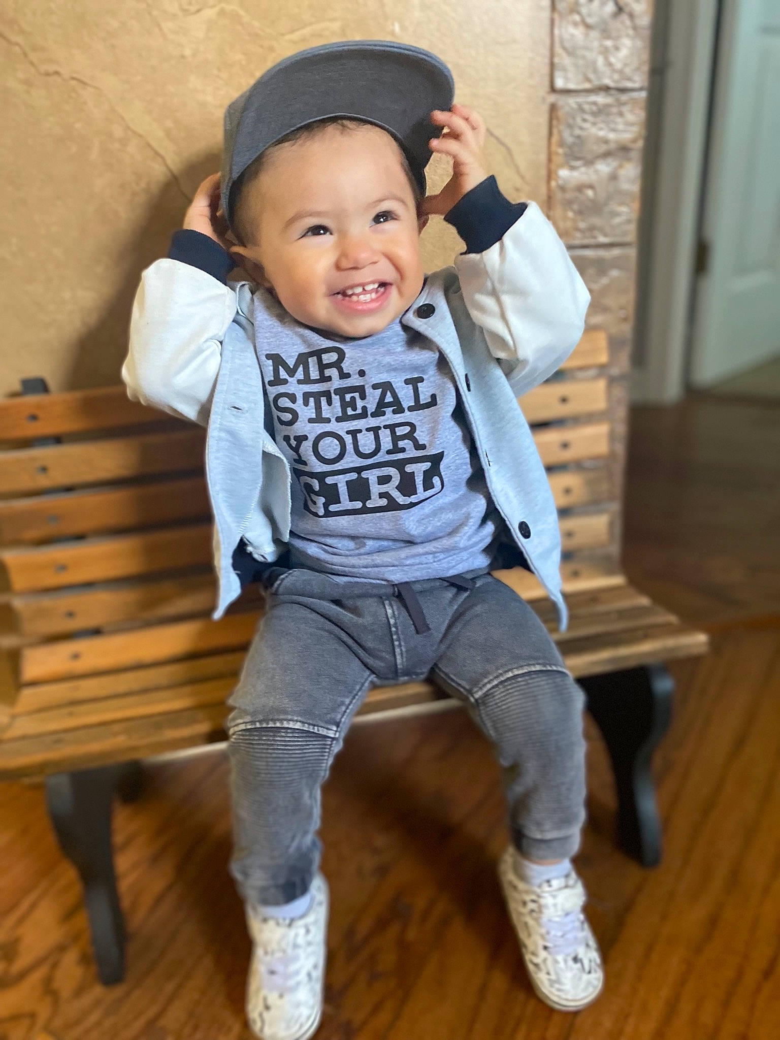 Sergio is registered to the contest to win money with this photo: baby, baby_toddler_clothing, cap, child, eye, face, flash_photography, happy, hardwood, hat, headgear, outerwear, person, skin, sleeve, smile, street_fashion, t_shirt, toddler, waist
