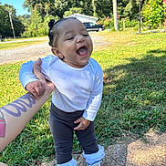 Ocean joined the competition — help win amazing prizes! toddler, child, laughing, happy, outdoor, grass, sneakers, white_shirt, tattoo, hand_holding, basketball_hoop, pants, sunny_day, trees, playful, person, young_child, smiling, footwear, sidewalk