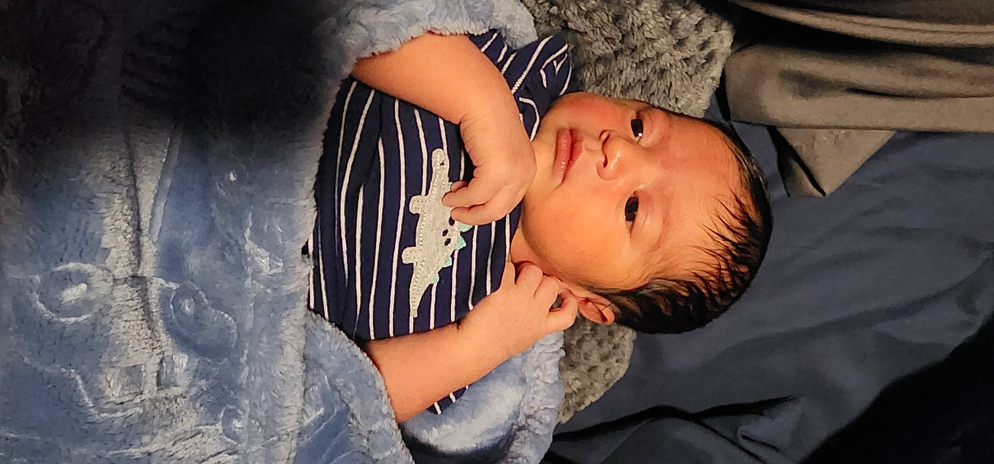 Antonio is registered to the contest to win money with this photo: arm, baby, baby_toddler_clothing, black_hair, cheek, cool, eyelash, flash_photography, hand, happy, headgear, human_body, iris, lip, mouth, neck, nose, person, skin, sleeve