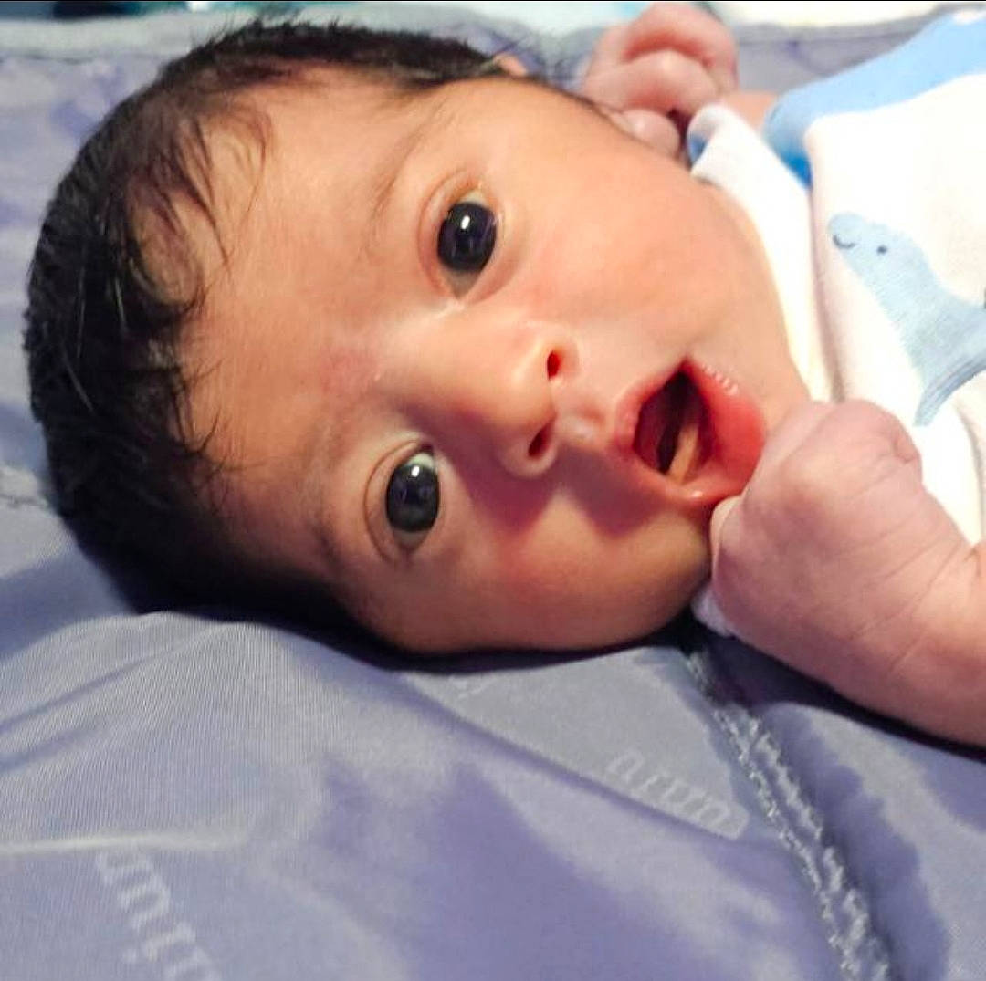 Antonio is registered to the contest to win money with this photo: baby, baby_toddler_clothing, cheek, child, comfort, eyelash, fun, happy, human_body, jaw, lip, mouth, no_expression, nose, person, portrait_photography, skin, thumb, toddler