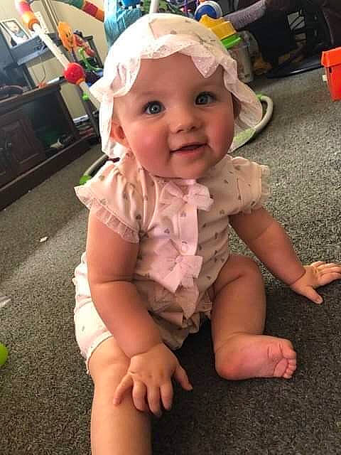 Khloie joined the competition — help win amazing prizes! baby, baby_laughing, baby_toddler_clothing, cheek, child, fashion_accessory, fun, hair_accessory, hand, head, headgear, headwear, person, play, skin, smile, sun_hat, toddler