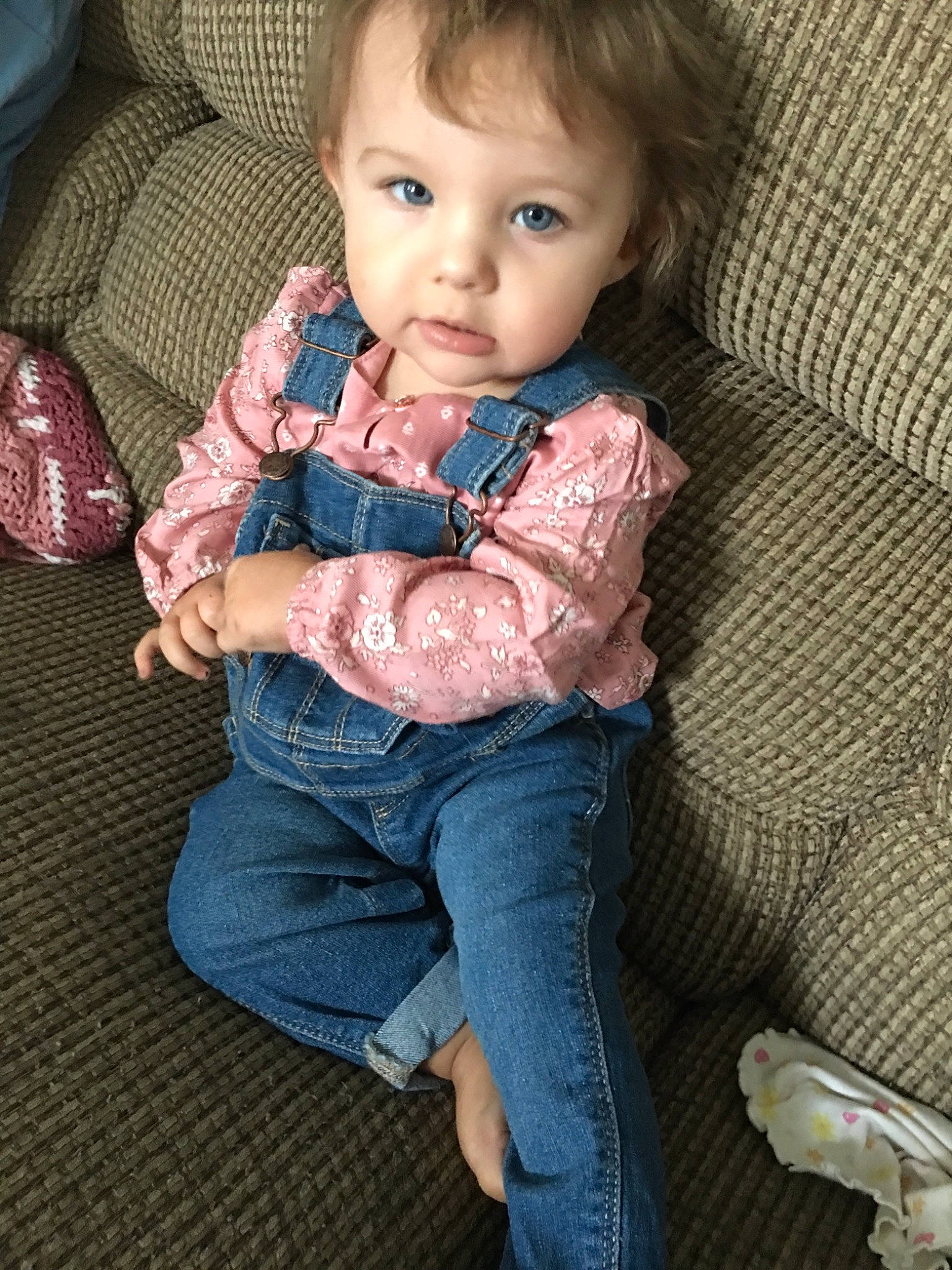 Khloie is registered to the contest to win money with this photo: baby, cheek, child, jeans, leg, person, shoe, sitting, skin, toddler