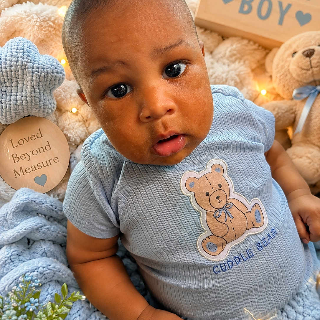 Camiri joined the competition — help win amazing prizes! baby, boy, infant, cute, blue_shirt, cuddle_bear, blanket, soft_toy, teddy_bear, fairy_lights, cozy, cute_baby, portrait, indoor, closeup, child, love, decor, sign, curious