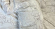 Camiri is registered to the contest to win money with this photo: newborn, baby, infant, sleeping, pajamas, hat, blanket, teddy_bear_pattern, bed, cute, cozy, soft, clothing, child, indoors, resting, person, baby_clothes, fabric, floor
