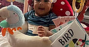 Camiri is registered to the contest to win money with this photo: baby, child, colorful, comfort, cuddly_toy, cute, feet, floor_mat, hands, hanging_rings, happy, head_support, indoor, infant, parental_care, play_seat, plush_toy, smiling, striped_shirt, toy