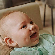 Athanase participe au concours pour gagner de l'argent avec cette photo : baby, smile, dimples, face, child, happy, clothing, mint_green, shirt, knitted_cushion, cozy, portrait, indoor, infant, cheerful, closeup, head, skin, expression, young_child