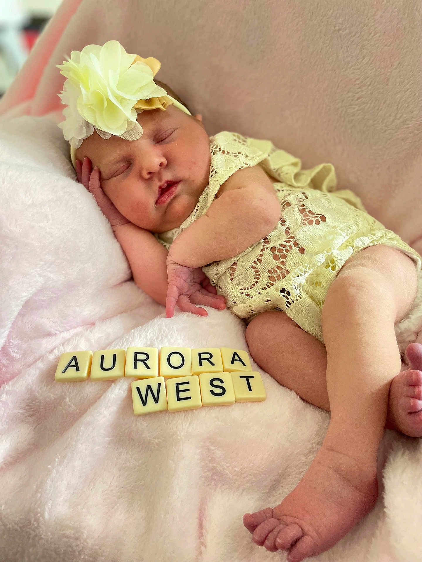 Aurora West is registered to the contest to win money with this photo: adorable, baby, blanket, child, closeup, cozy, cute, flower_headband, infant, lace_clothing, letters, name, newborn, peaceful, pink, portrait, resting, sleeping, soft_texture, tiles