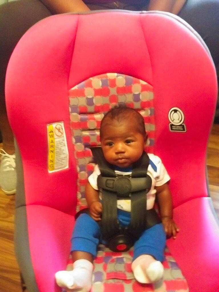 Justina is registered to the contest to win money with this photo: baby, baby_toddler_clothing, blue, child, clothing, comfort, facial_expression, fun, hair, head, leisure, organ, person, pink, play, product, recreation, red, sitting, toddler