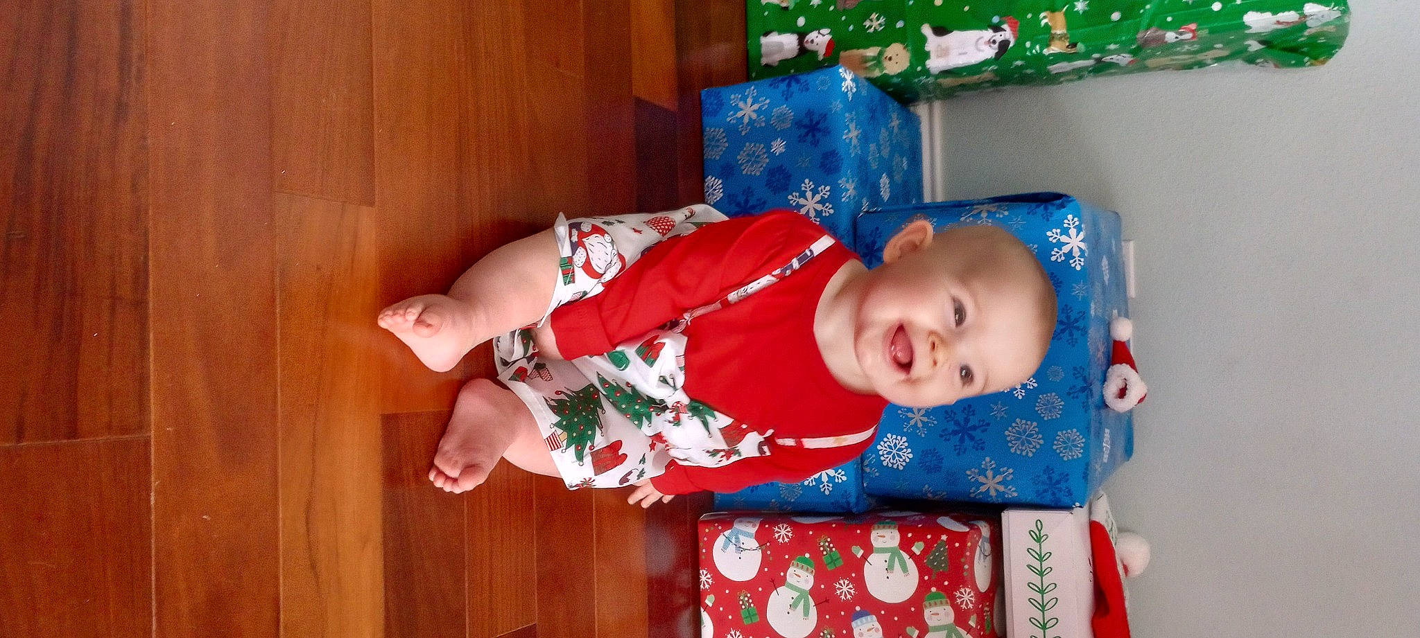 Elizabeth joined the competition — help win amazing prizes! baby, baby_products, baby_toddler_clothing, child, christmas_eve, comfort, event, fun, happy, hardwood, hat, holiday, joy, pattern, person, play, room, sitting, sleeve, smile