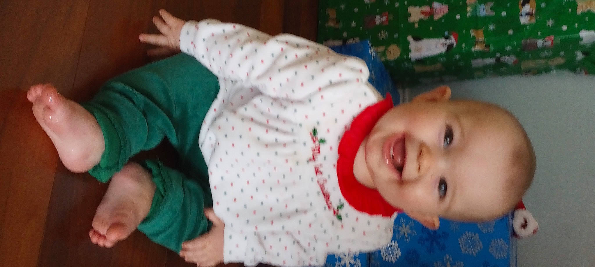 Elizabeth is registered to the contest to win money with this photo: baby, baby_laughing, baby_toddler_clothing, cheek, child, finger, fun, gesture, happy, human_body, joy, mammal, mouth, organ, pattern, person, skin, sleeve, smile, textile