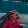 baby, child, pool, pink_clothing, hat, sunglasses, outdoor, summer, water, swimwear, infant, sunhat, toy, nature, trees, backyard, cute, sitting, person, leisure