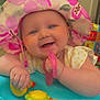 Nova joined the competition — help win amazing prizes! baby, child, smile, hat, toy, play, colorful, indoors, happy, face, hand, blue, yellow, pink, plastic, person, infant, cute, cheerful, clothing