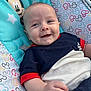 baby, smiling, infant, mickey_mouse, baby_seat, colorful, outdoor, clothing, happy, portrait, child, cute, seat, fabric, pattern, drool, person, young_child, relaxing, sunlight