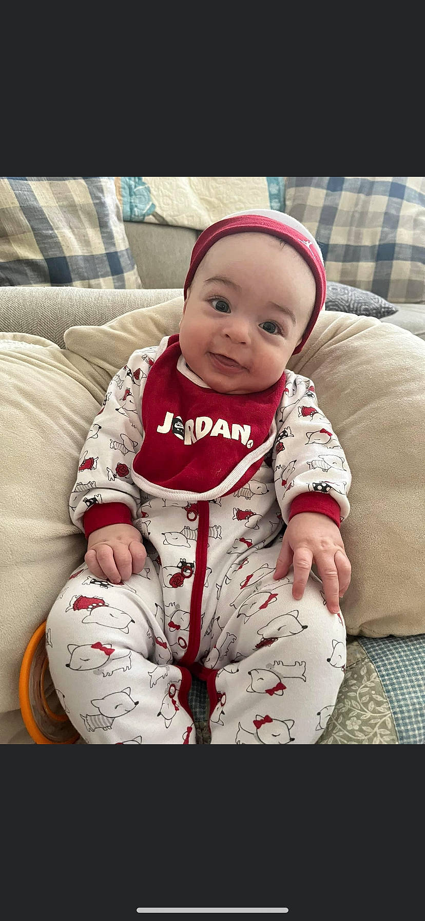 Ezra is registered to the contest to win money with this photo: baby, baby_sleeping, baby_toddler_clothing, cap, carmine, child, christmas, comfort, couch, fictional_character, fur, happy, head, lap, linens, person, sitting, sleeve, smile, textile