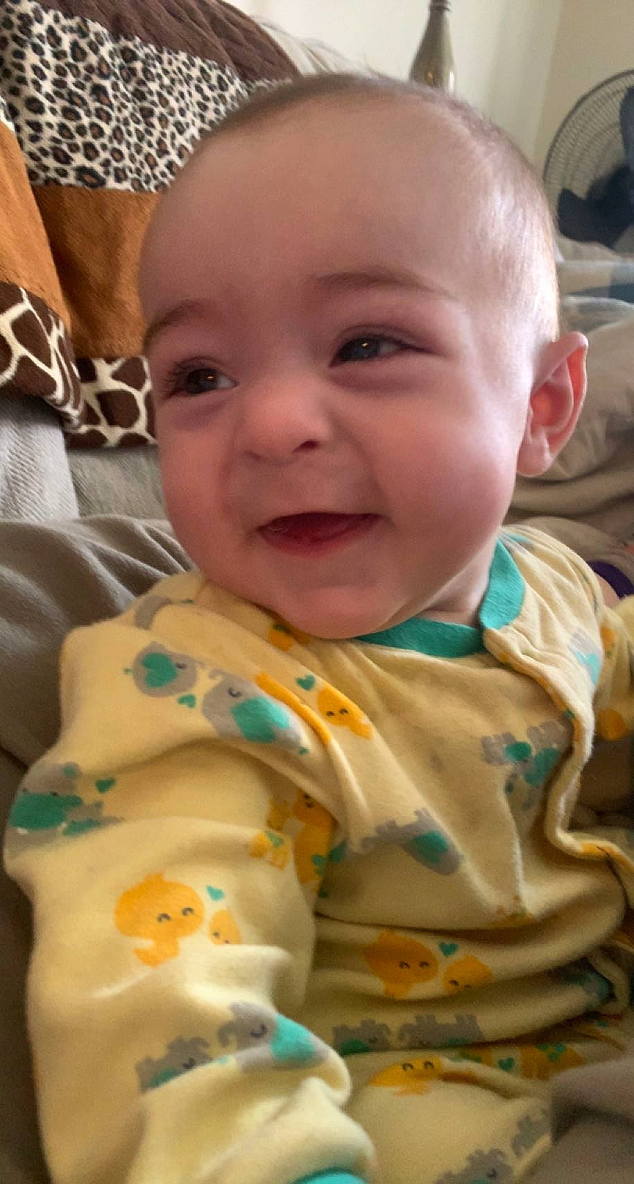 Ezra is registered to the contest to win money with this photo: baby, baby_toddler_clothing, bib, cheek, child, comfort, fashion_accessory, fun, happy, head, infant_bodysuit, iris, linens, mouth, nose, person, skin, sleeve, smile, textile