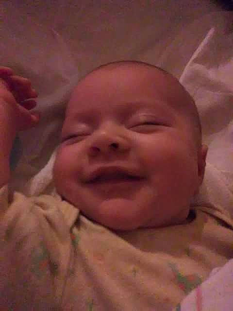 Joyce is registered to the contest to win money with this photo: cheek, child, chin, close_up, ear, eye, eyebrow, face, finger, forehead, hand, head, infant, lip, mouth, nose, person, skin, smile, toddler