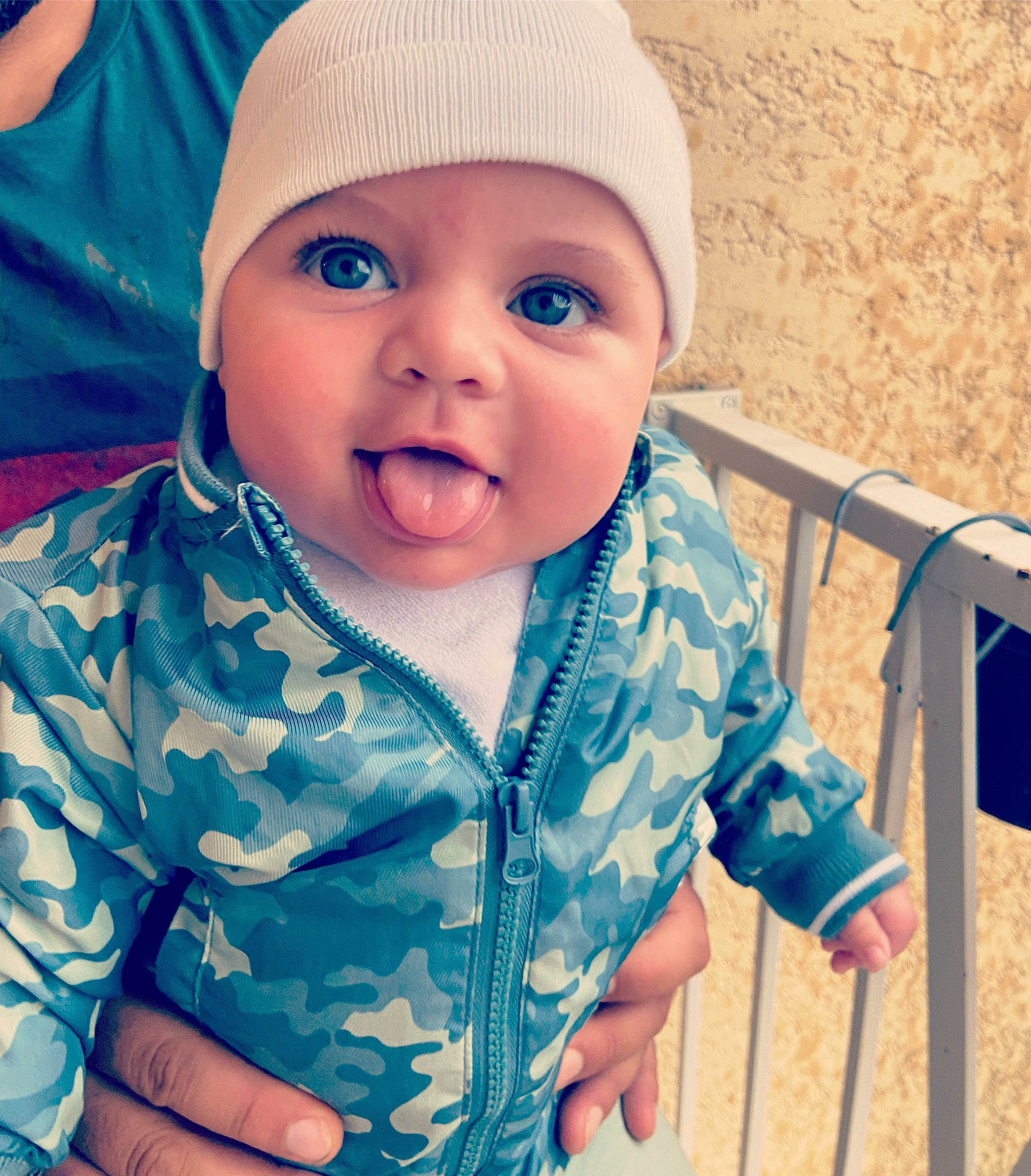 Isaiah participe au concours pour gagner de l'argent avec cette photo : azure, baby, baby_toddler_clothing, blue, cap, cheek, cool, eye, face, facial_expression, happy, headgear, headwear, iris, lip, nose, outerwear, person, product, skin