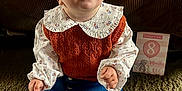 Cecelia joined the competition — help win amazing prizes! baby, child, infant, headband, orange, vest, blouse, denim_skirt, white_tights, carpet, milestone_card, sitting, curious_expression, indoor, portrait, cute, person, floor, clothing, headwear