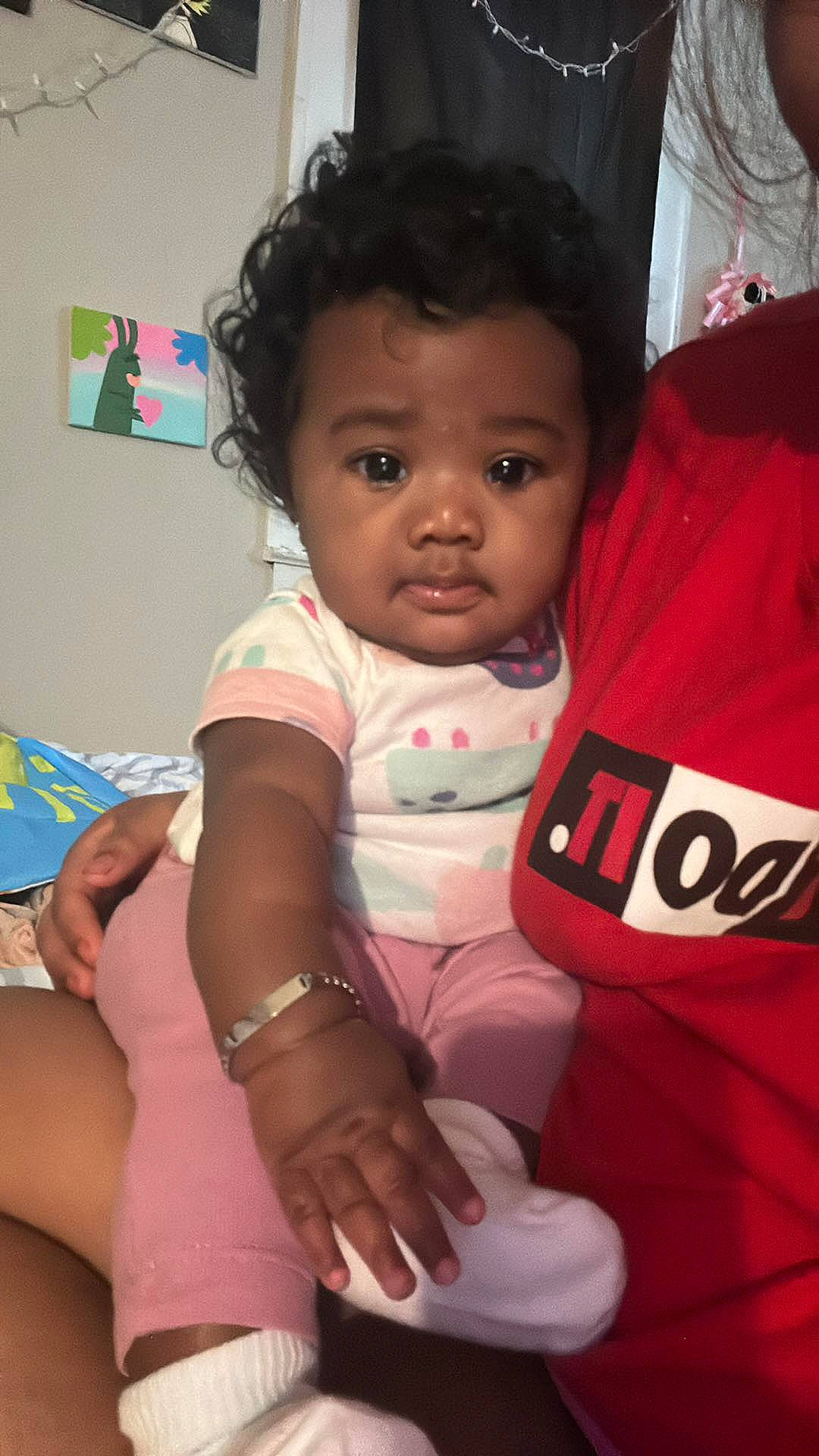 Ny'Asia is registered to the contest to win money with this photo: baby, baby_products, baby_toddler_clothing, carmine, cheek, child, comfort, fun, gesture, happy, iris, person, pink, room, sitting, skin, sleeve, t_shirt, thigh, toddler