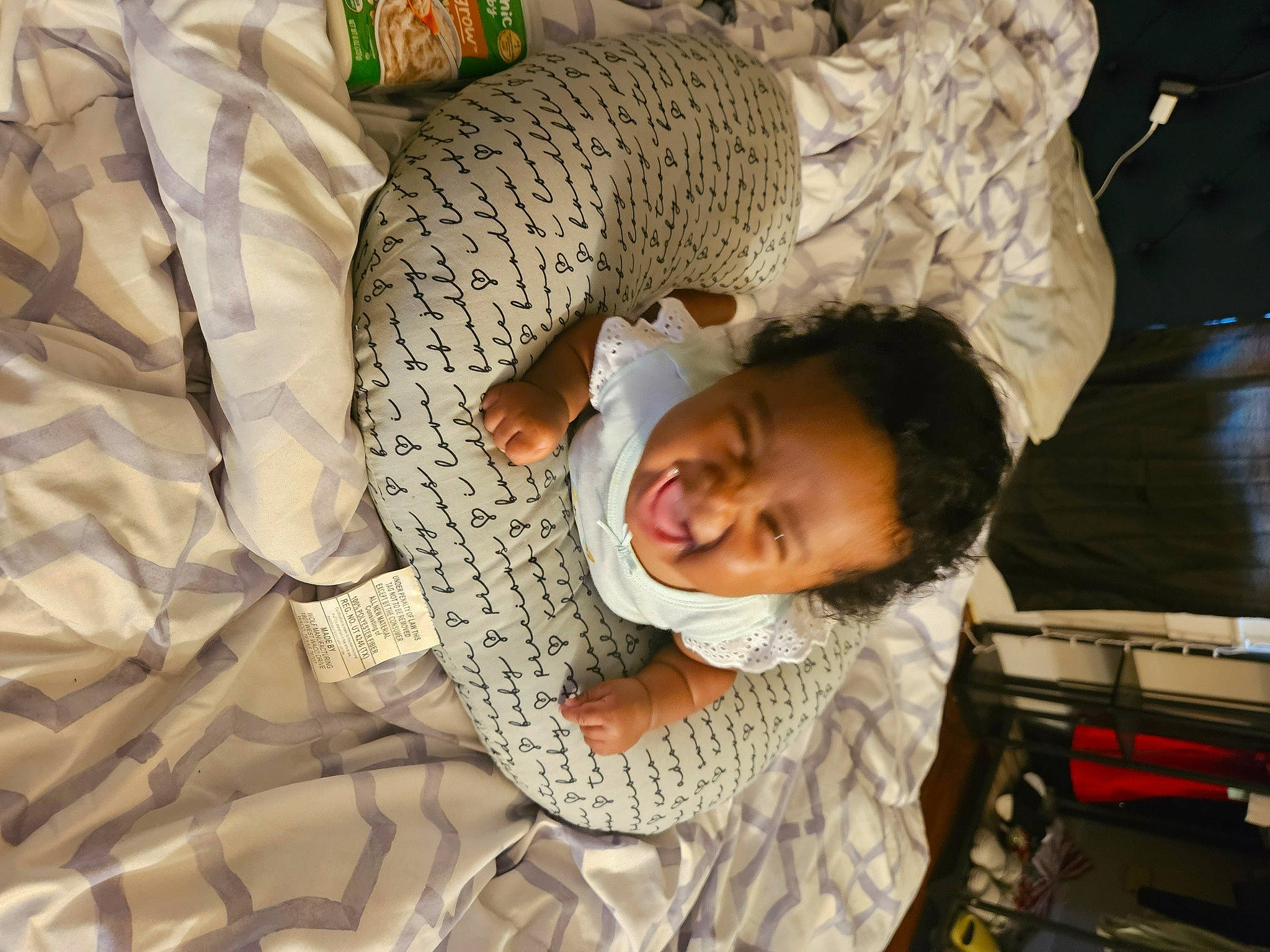 Ny'Asia is registered to the contest to win money with this photo: baby, bedding, child, comfort, fur, gesture, linens, pattern, person, room, sleep, toddler