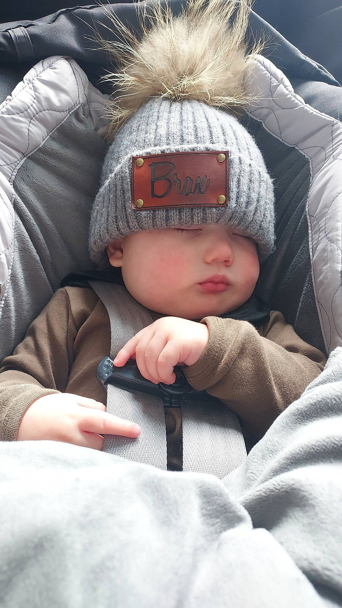 Braxton joined the competition — help win amazing prizes! cap, comfort, eye, face, finger, freezing, gesture, glasses, hand, happy, head, headgear, headwear, knit_cap, mammal, outerwear, person, skin, textile, toddler