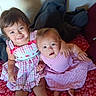 Katalina joined the competition — help win amazing prizes! children, siblings, baby, toddler, girls, sisters, smiling, portrait, indoors, bed, bedspread, pink_clothing, matching_outfits, affection, hug, family, sitting, couch, blanket, home