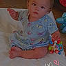 baby, child, infant, sitting, cross_legged, portrait, serious_expression, face, eyes, butterfly_print, dress, blanket, toy, colorful_toy, indoor, home, floor, playtime, text_overlay, heart