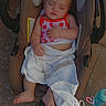 Lila is registered to the contest to win money with this photo: baby, sleeping, infant, car_seat, stroller, towel, bottle, outdoor, patio, tile_floor, portrait, child, closed_eyes, pink_clothing, strawberry_pattern, barefoot, handwritten_overlay, heart_doodle, sunlight, resting