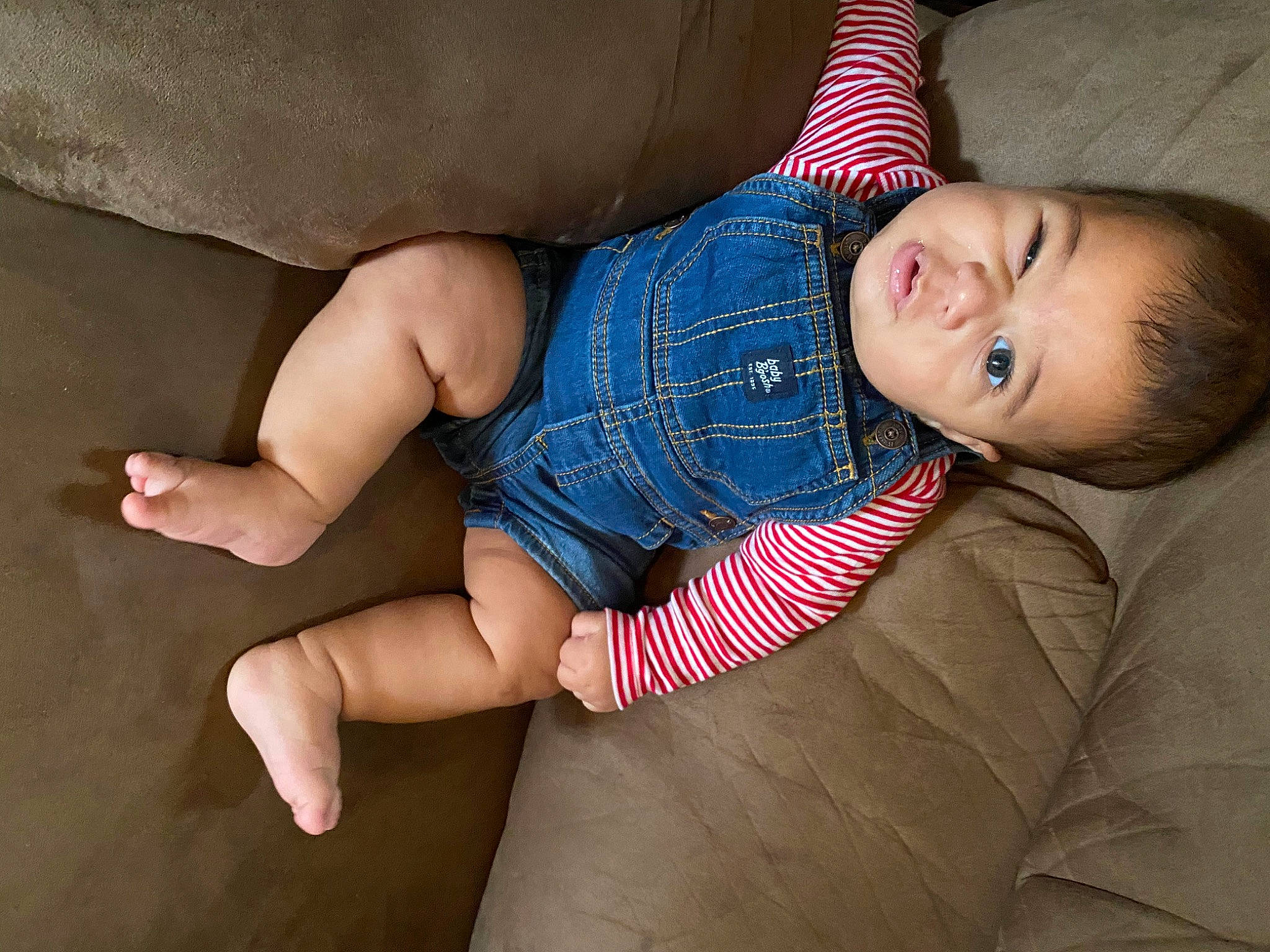 Koa is registered to the contest to win money with this photo: baby, baby_toddler_clothing, cheek, comfort, dress, elbow, finger, foot, hand, human_body, human_leg, joint, knee, leg, person, skin, sleeve, sock, thigh, toddler