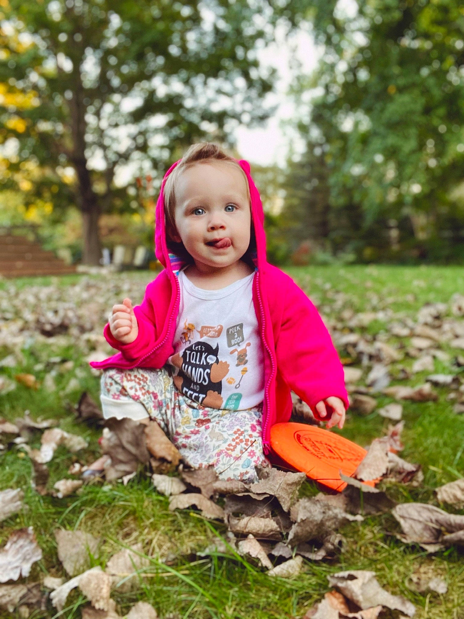 Liliana joined the competition — help win amazing prizes! baby, baby_toddler_clothing, child, deciduous, eye, face, grass, happy, head, jacket, leaf, leisure, people_in_nature, person, plant, pumpkin, recreation, smile, toddler, tree