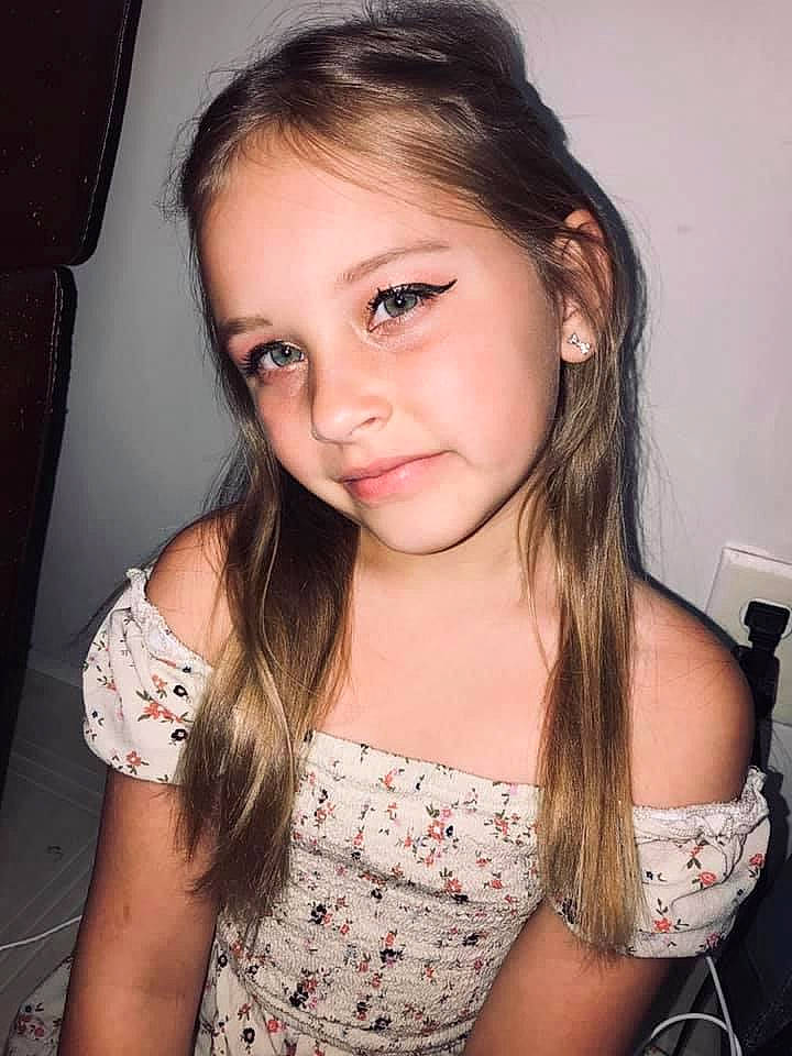 Addie is registered to the contest to win money with this photo: cheek, chin, ear, eye, eyebrow, eyelash, face, flash_photography, hair, happy, head, human_body, iris, jaw, joint, lip, neck, nose, person, shoulder