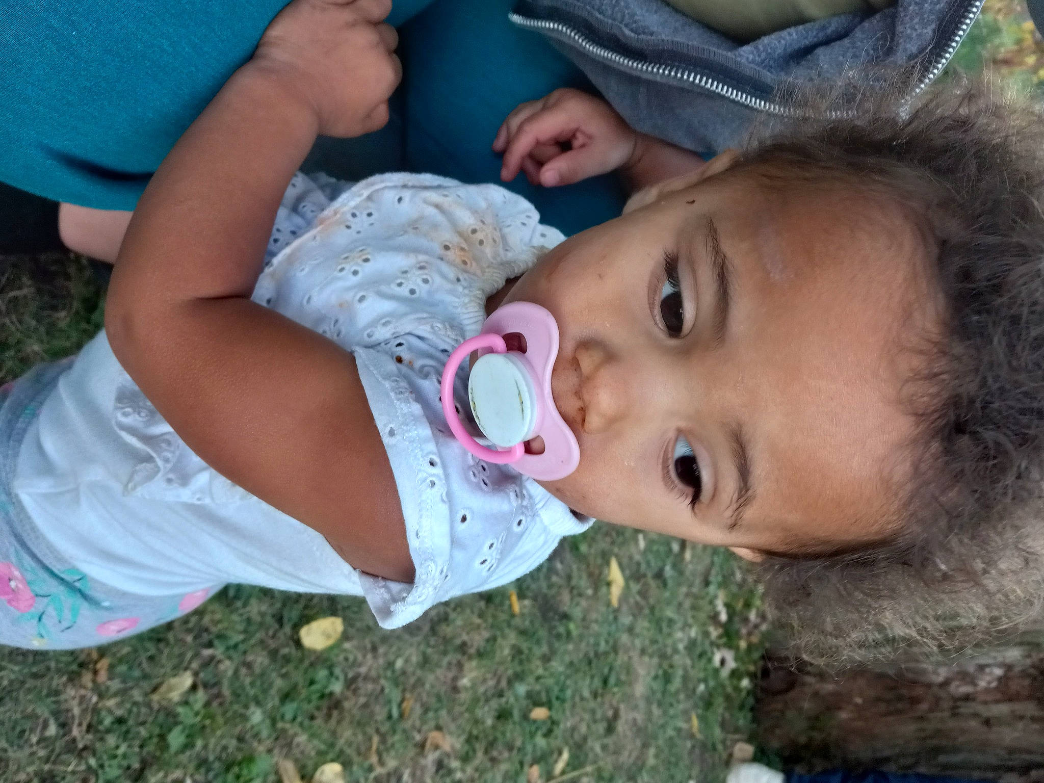 Lalia is registered to the contest to win money with this photo: baby, baby_products, baby_toddler_clothing, blue, cheek, child, eyelash, fun, grass, happy, hat, lip, mouth, nose, person, plant, sitting, skin, smile, toddler