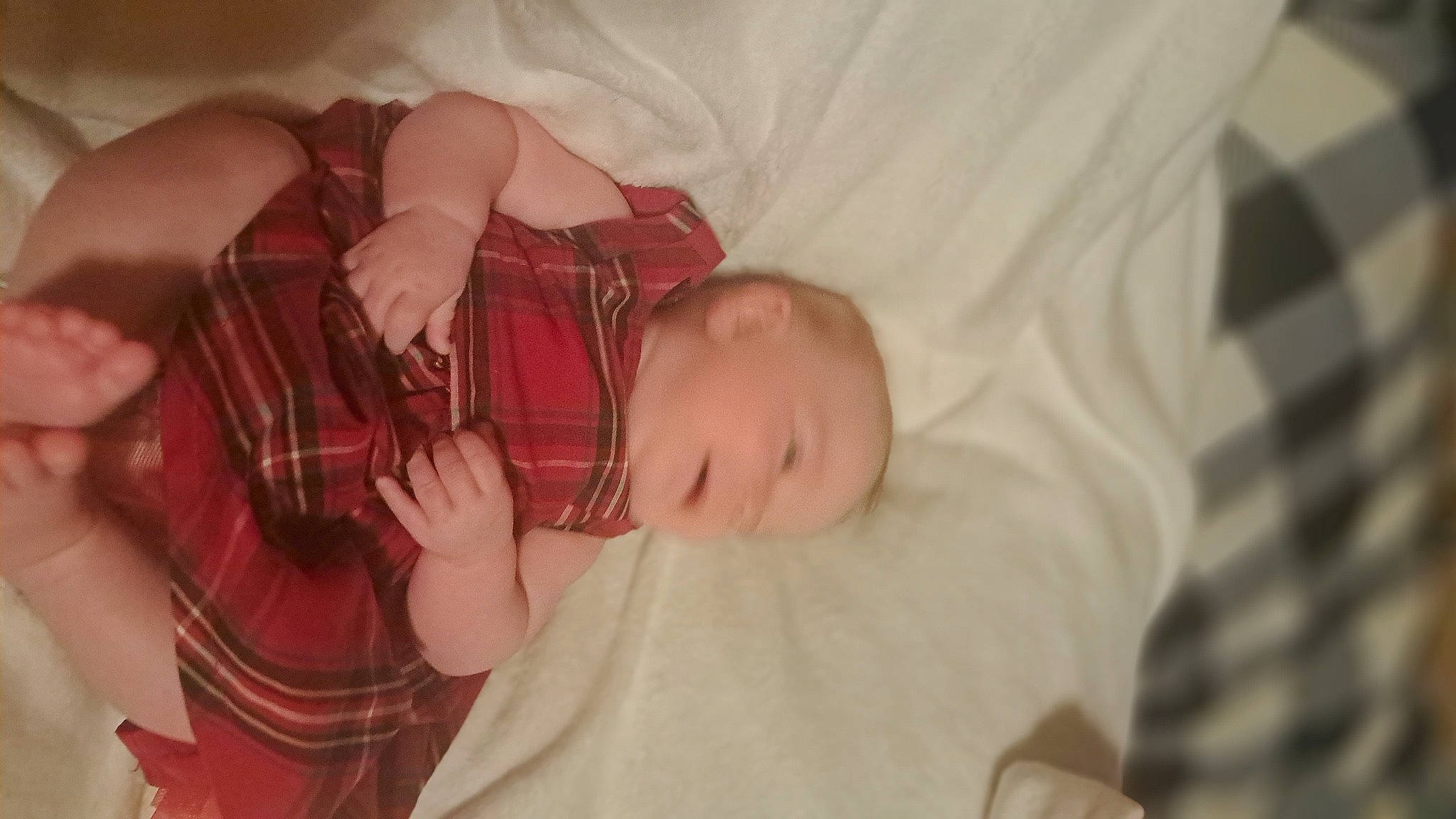 Becklyn is registered to the contest to win money with this photo: abdomen, baby, baby_products, baby_toddler_clothing, bedtime, child, comfort, finger, flesh, human_body, linens, pattern, person, plaid, room, sleep, sleeve, tartan, textile, toddler