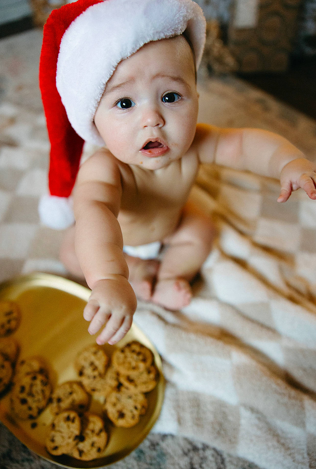 Winston is registered to the contest to win money with this photo: baby, baby_toddler_clothing, cap, child, eye, face, finger_food, food, fun, fur, happy, headwear, ingredient, lip, nuts_seeds, person, photograph, recipe, skin, smile