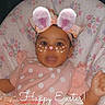 Sariyah joined the competition — help win amazing prizes! baby, child, easter, bunny_ears, pink_clothing, floral_pattern, cushion, headband, smiling, face_filter, holiday, cheerful, indoors, cute, portrait, infant, happy, festive, decorative, playful