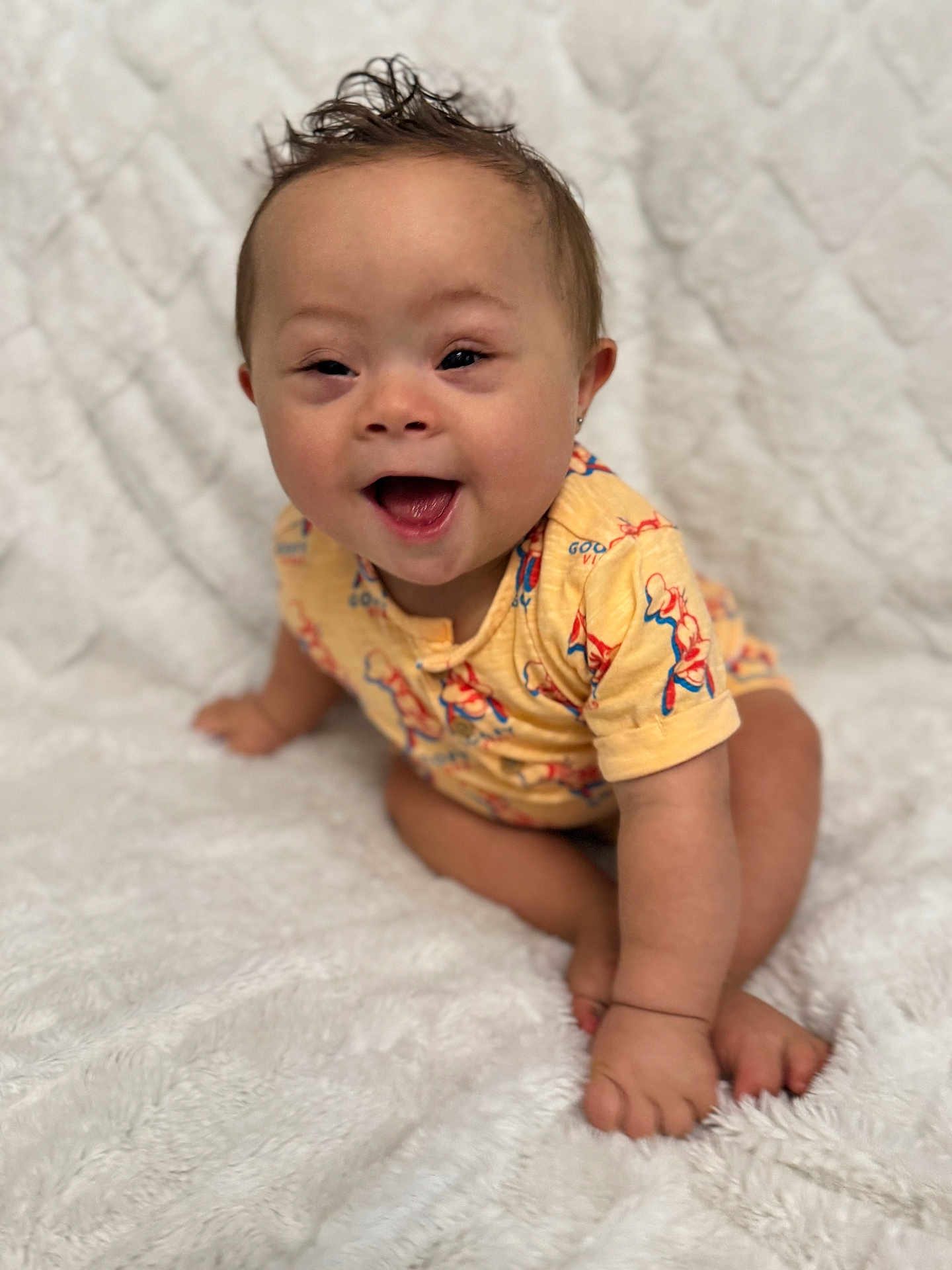 Avery-Ray is registered to the contest to win money with this photo: baby, child, smiling, crawling, yellow_clothing, happy, face, hair, indoor, blanket, cute, portrait, one_person, infant, skin, eyes, mouth, earrings, soft_texture, white_background