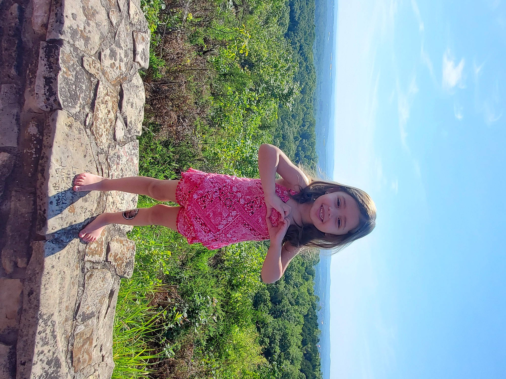 Natalia is registered to the contest to win money with this photo: arm, dress, fun, grass, happy, hat, joy, leisure, magenta, people_in_nature, person, plant, recreation, sky, smile, spring, tree, trunk, waist, wood