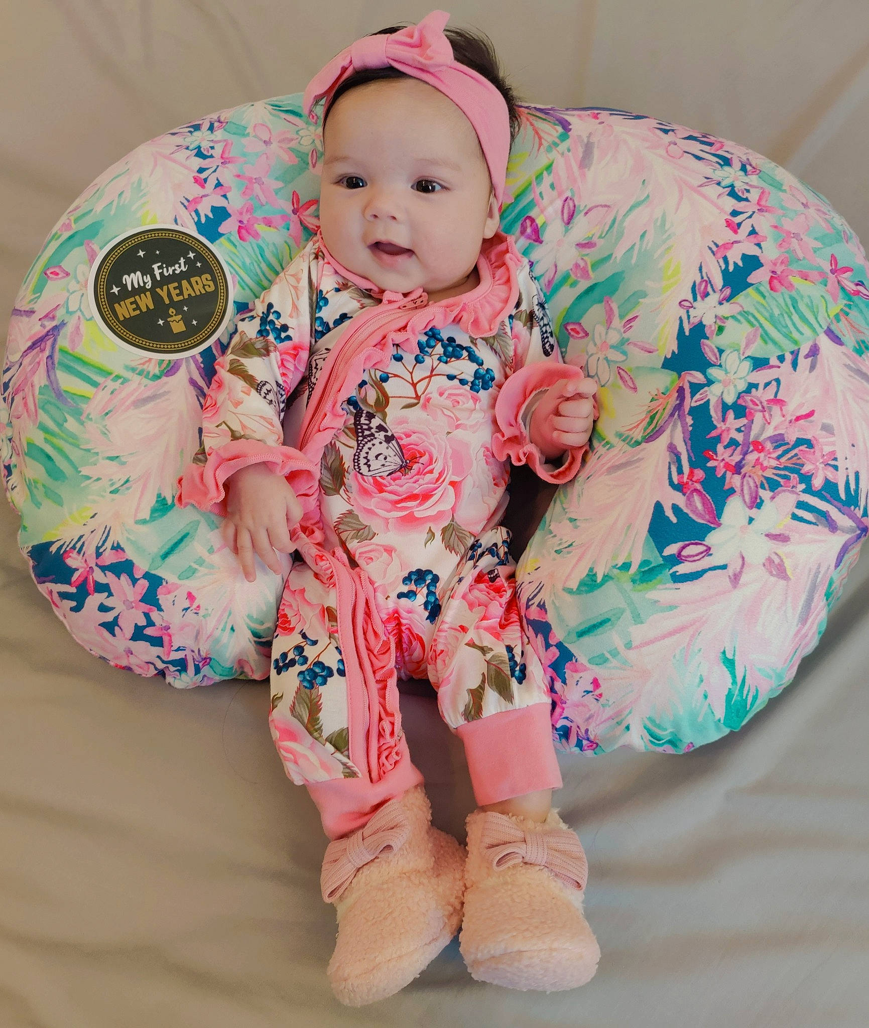 Karlee joined the competition — help win amazing prizes! baby, baby_toddler_clothing, cheek, child, comfort, couch, face, finger, happy, headwear, leg, linens, outerwear, pattern, person, pink, sitting, skin, sleeve, smile