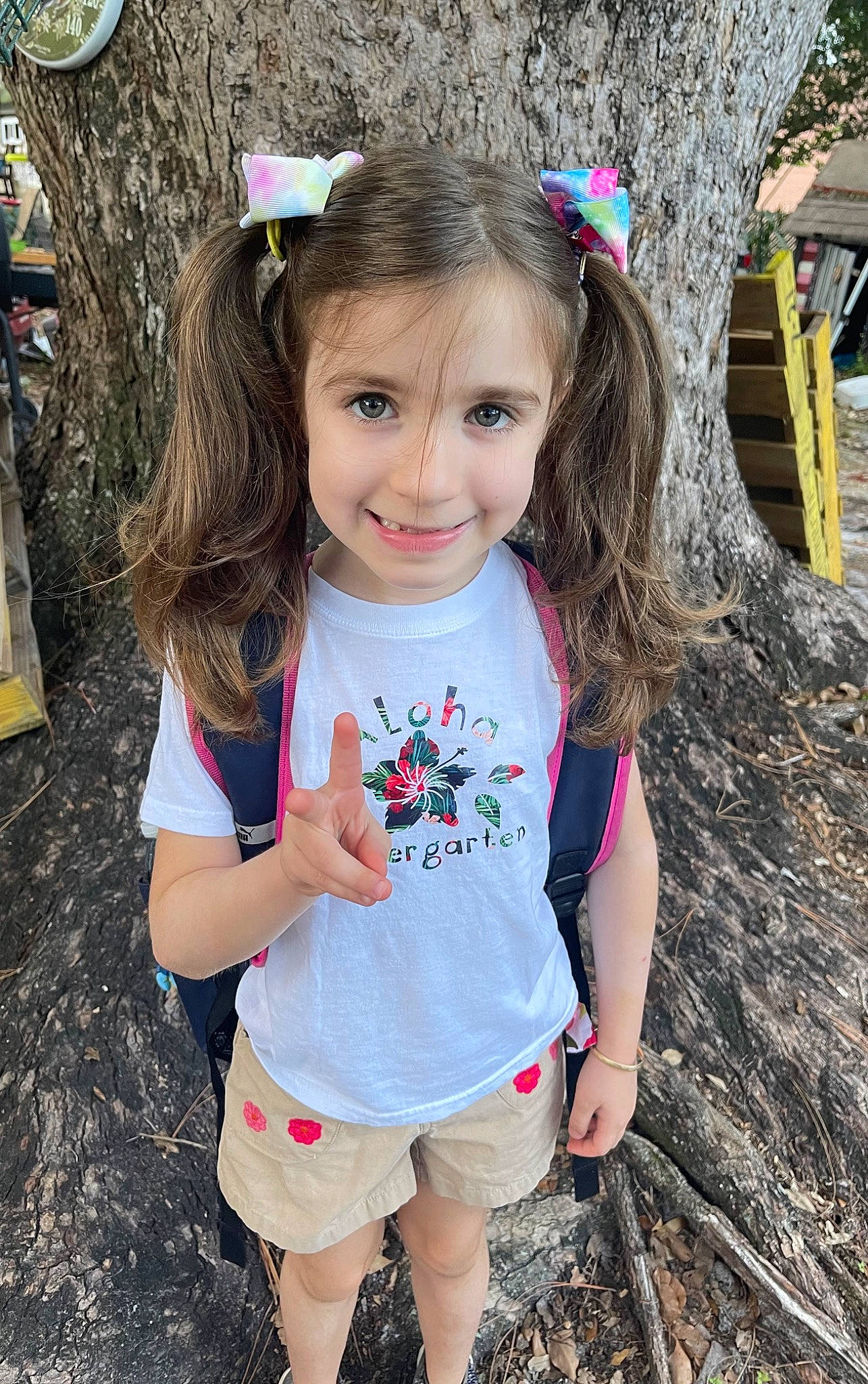Audrianna is registered to the contest to win money with this photo: baby_toddler_clothing, child, chin, eye, grass, hairstyle, happy, iris, joy, leisure, people_in_nature, person, photograph, pink, plant, shorts, skin, sleeve, smile, standing