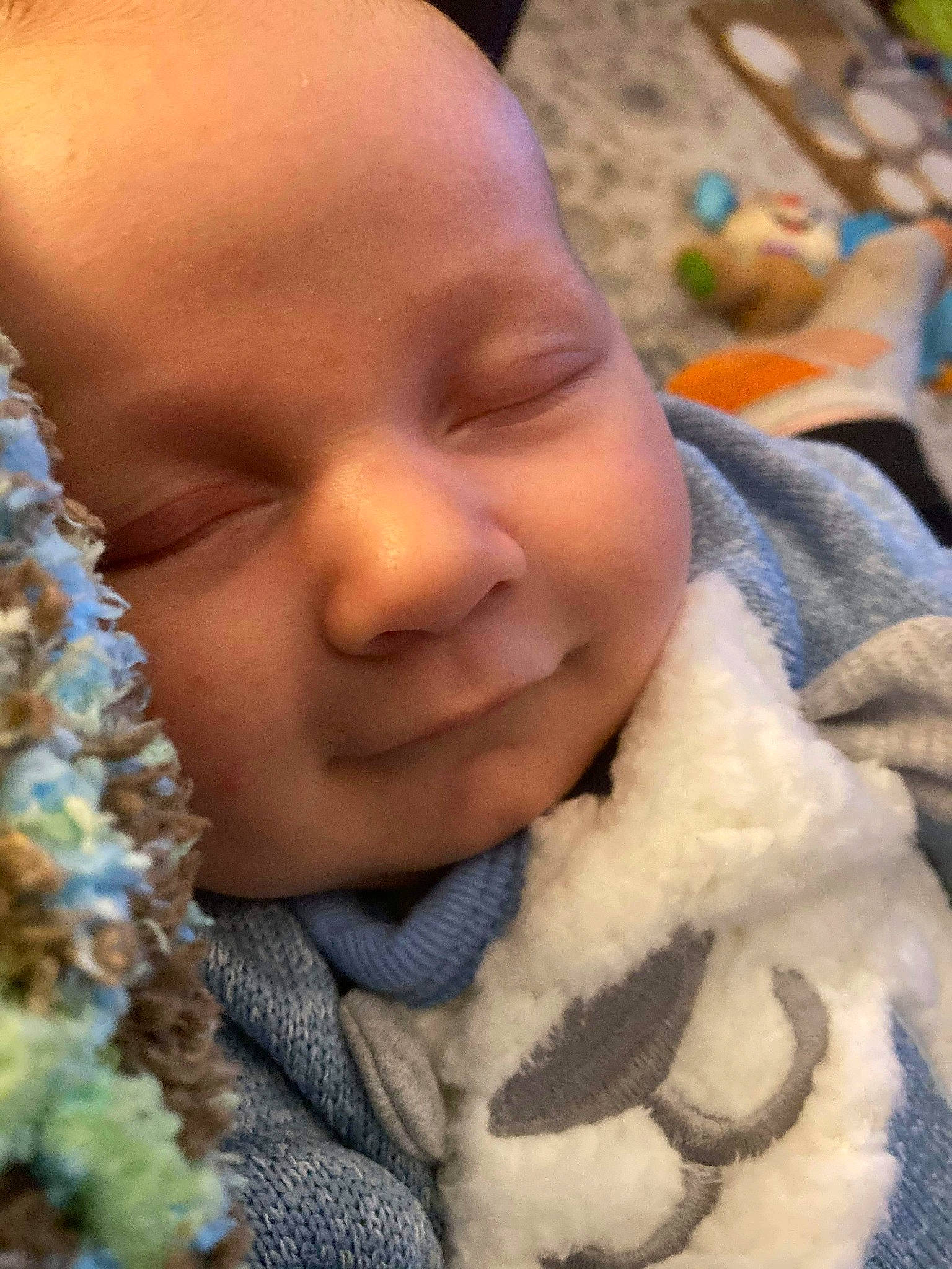 Wesley is registered to the contest to win money with this photo: baby, cheek, child, face, head, nose, person, skin, sleep, smile, toddler, wool