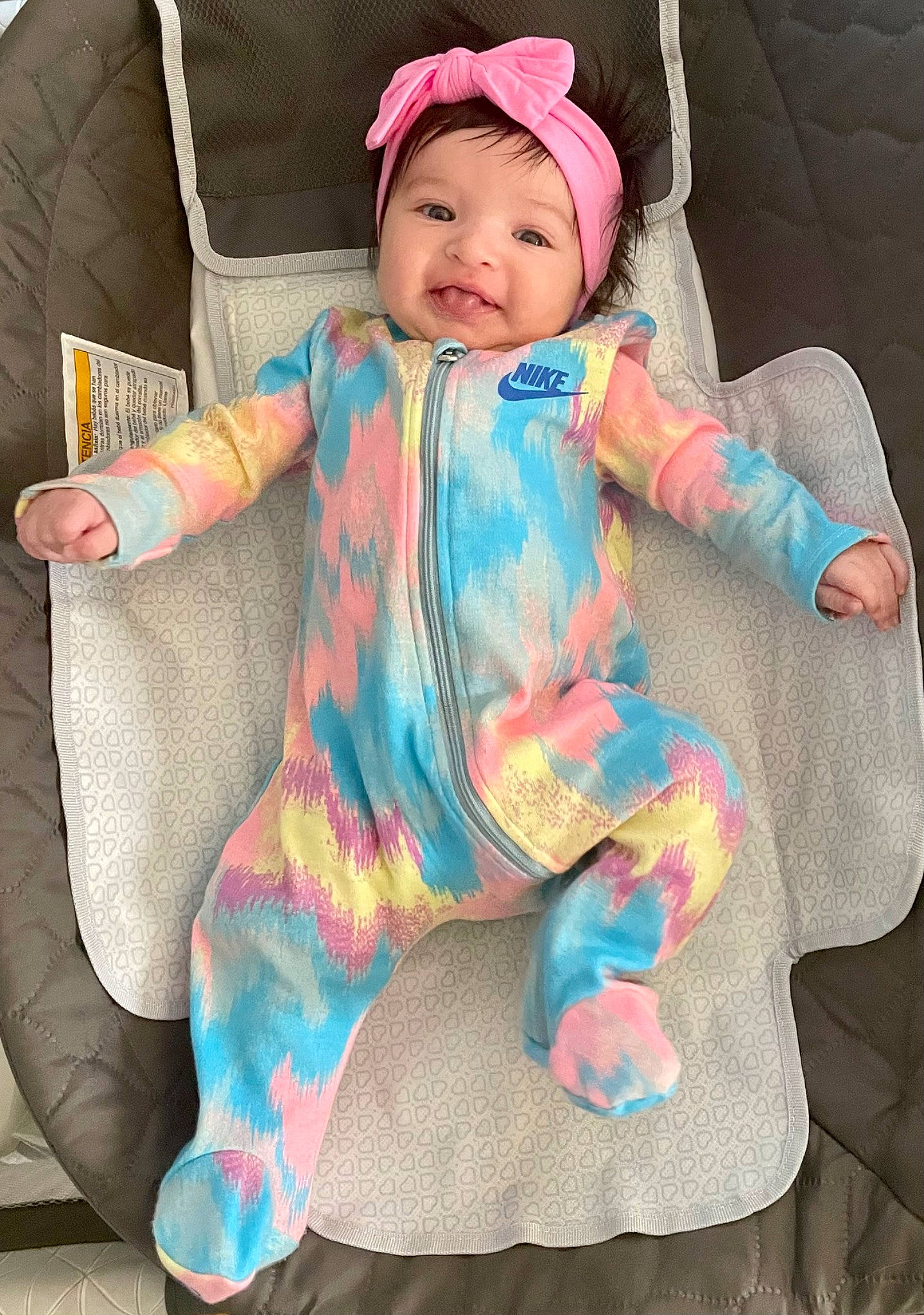 Alexandra is registered to the contest to win money with this photo: baby, baby_toddler_clothing, cheek, comfort, cool, dress, eye, face, finger, happy, head, headwear, leg, outerwear, pattern, person, pink, skin, sleeve, smile