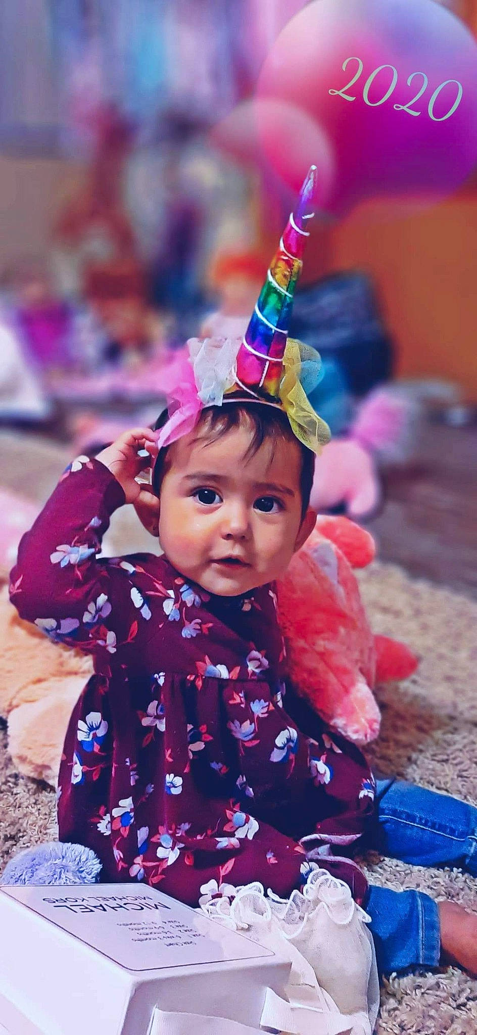 Briana is registered to the contest to win money with this photo: baby, child, child_model, fashion_accessory, fun, hair_accessory, headgear, party_supply, person, pink, play, smile, toddler