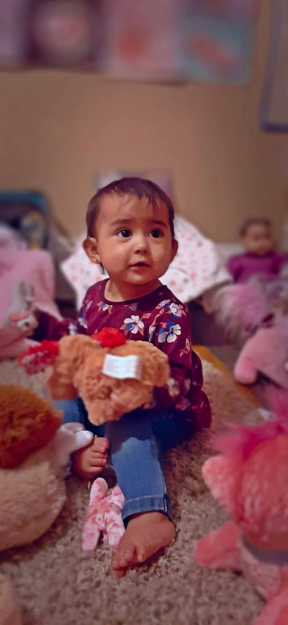Briana is registered to the contest to win money with this photo: baby, cheek, child, eye, face, head, people, person, pink, play, sitting, skin, smile, stuffed_toy, teddy_bear, toddler, toy