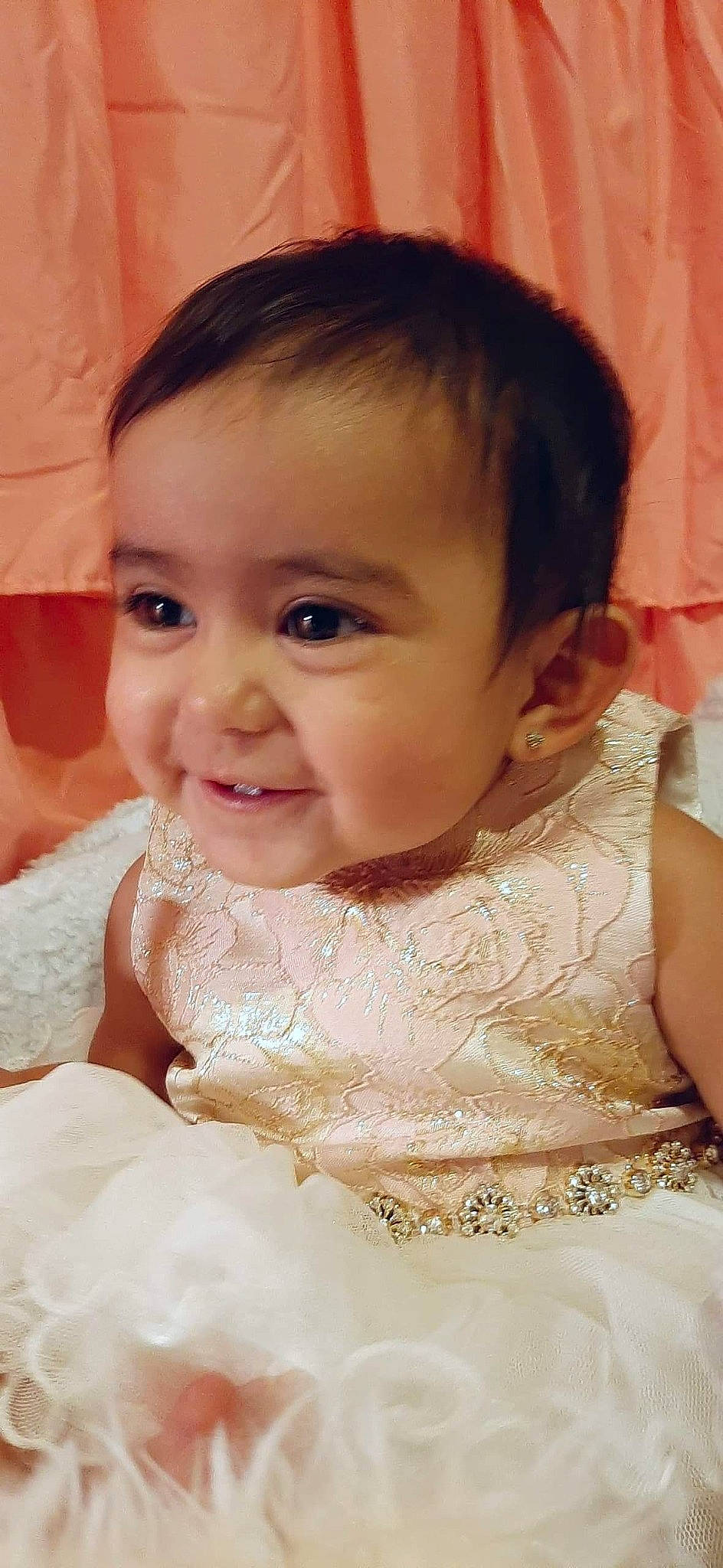 Briana is registered to the contest to win money with this photo: baby, cheek, child, chin, dress, eye, eyebrow, face, facial_expression, forehead, hair_accessory, happy, head, iris, lip, nose, person, skin, smile, toddler