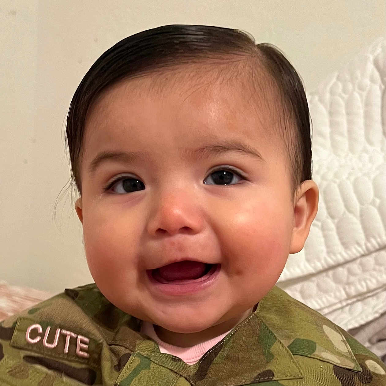 Alaiya is registered to the contest to win money with this photo: army, baby, babylaughing, bodypart, clothing, coat, face, happy, head, jacket, military, militaryuniform, mouth, officer, person, photography, portrait, smile, soldier, teeth