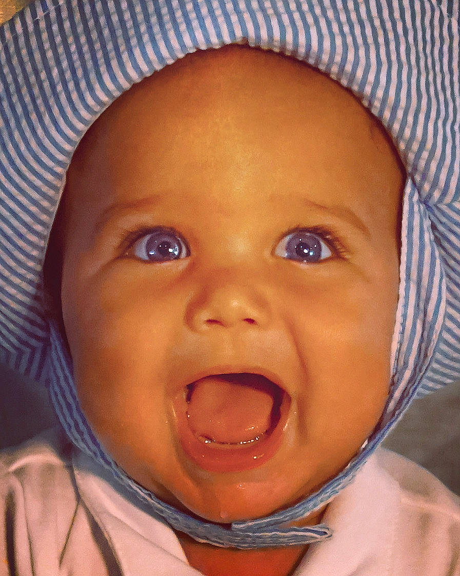 Quinton is registered to the contest to win money with this photo: baby, cheek, chin, ear, eyebrow, eyelash, forehead, happy, hat, human_body, iris, jaw, lip, mouth, nose, person, skin, smile, toddler, tongue